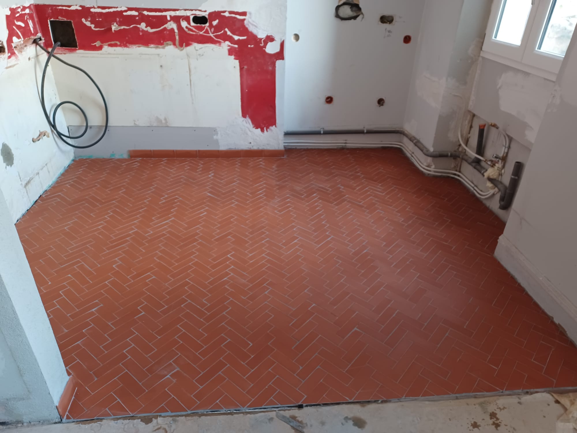 Pose de carrelage en motif Herringbone - 